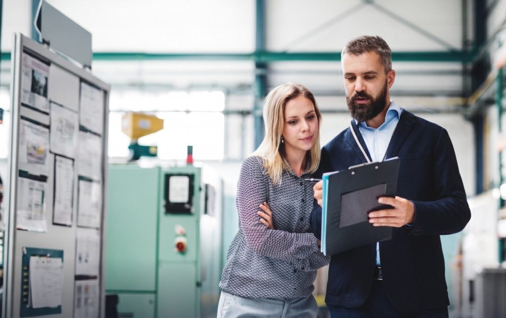 Facility managers review checklist for real-time visibility in operations