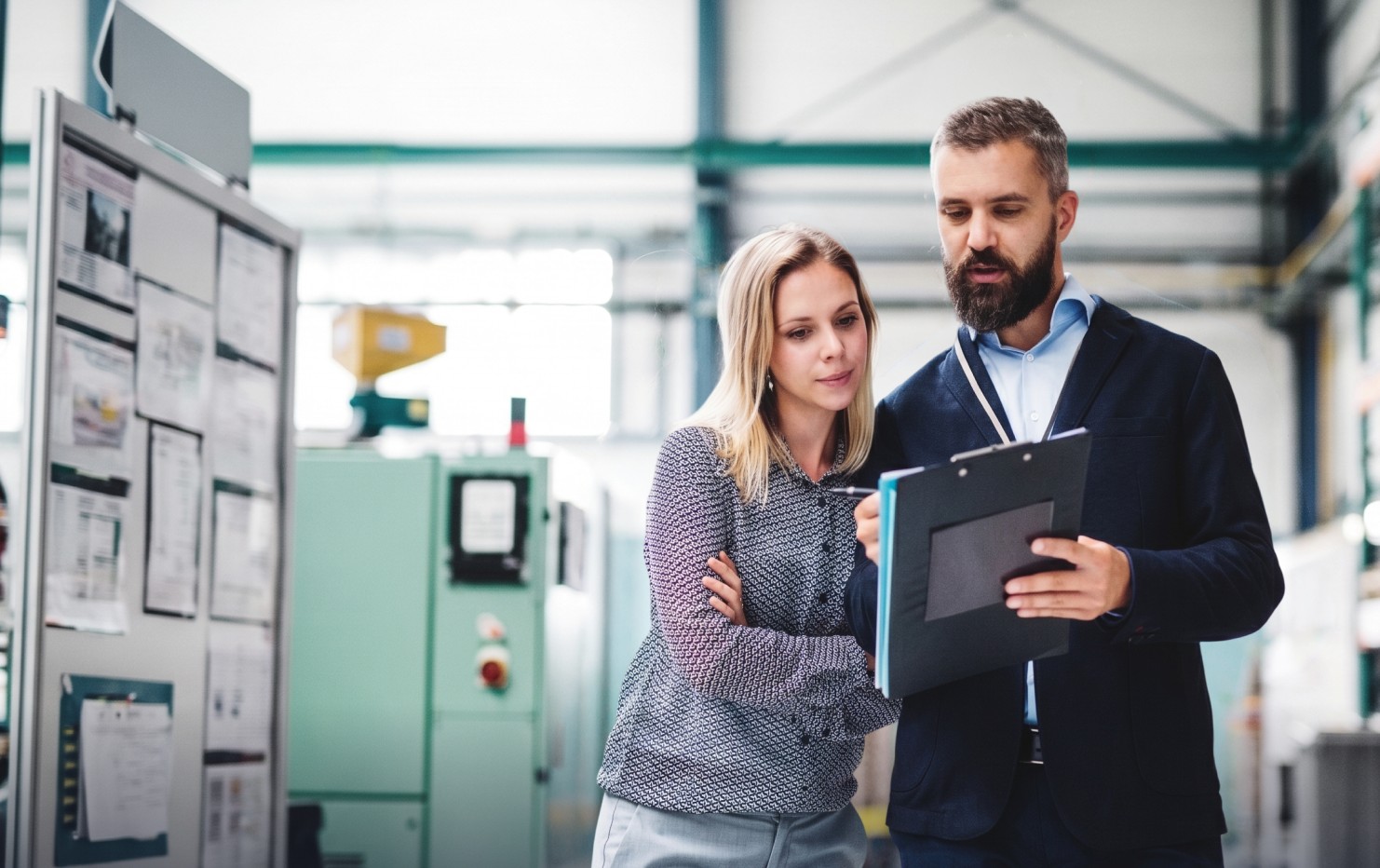 Facility managers review checklist for real-time visibility in operations
